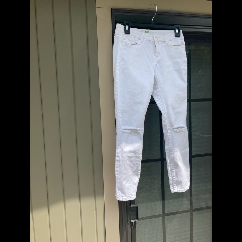 Ripped White Jeans size 28.  Skinny jeans. Ripped at the knees.